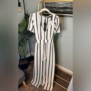 Striped romper (shorts and draped skirt surrounding in back).
